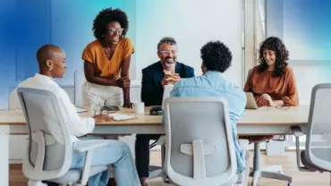 group of diverse professionals gathered at a table 