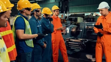 engineering and manufacturing professionals wearing high vis