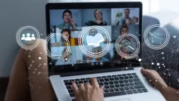 A person taking a training course on a laptop