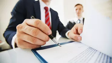 Young professional reading through a counter offer from his current employer