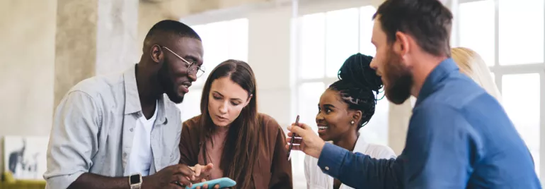 Colleagues collaborating together in work place 