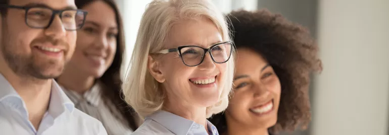 four professionals workers smiling