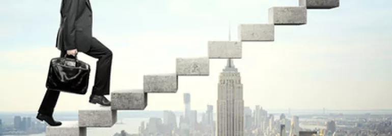 a man in a suit climbing up stairs, with a background of a city view