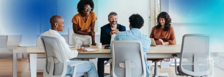 group of diverse professionals gathered at a table 