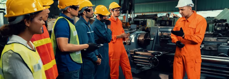 engineering and manufacturing professionals wearing high vis