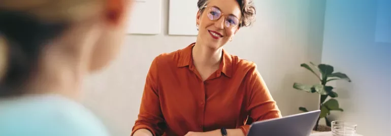 Employer happy at a interview whilst having a discussion with his candidate